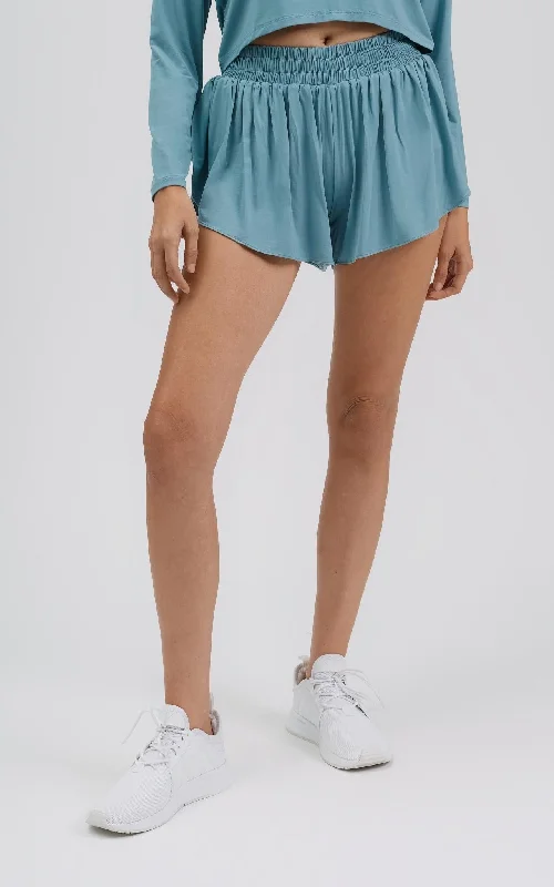 Culottes – Wide-legged, knee-length or mid-calf shorts that resemble a skirt but are more comfortable and practical.Culottes – Wide-legged, knee-length or mid-calf shorts that resemble a skirt but are more comfortable and practical.Free Flow High-Rise Short with Inside Biker Shorts - Oil Green Culottes – Wide-legged, knee-length or mid-calf shorts that resemble a skirt but are more comfortable and practical.Culottes – Wide-legged, knee-length or mid-calf shorts that resemble a skirt but are more comfortable and practical.Free Flow High-Rise Short with Inside Biker Shorts - Oil Green