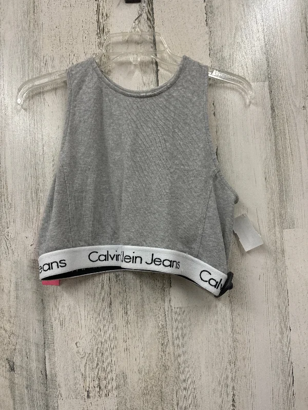 Criss-cross strap sports bra – Sports bra with straps that cross over at the back, providing extra support and a stylish look.Criss-cross strap sports bra – Sports bra with straps that cross over at the back, providing extra support and a stylish look.Grey Athletic Bra Calvin Klein, Size L Criss-cross strap sports bra – Sports bra with straps that cross over at the back, providing extra support and a stylish look.Criss-cross strap sports bra – Sports bra with straps that cross over at the back, providing extra support and a stylish look.Grey Athletic Bra Calvin Klein, Size L